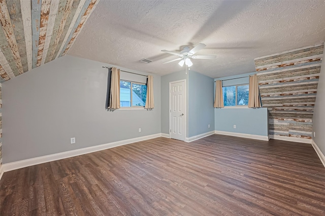 5942 Pebble Springs Dr, Houston, TX 77066 - additional living space with wood finished floors, a ceiling fan, vaulted ceiling, and a textured ceiling
