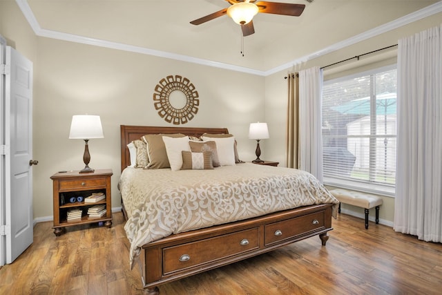 21006 Indigo Field Ln, Richmond, TX 77407 - bedroom with wood finished floors, crown molding, and ceiling fan
