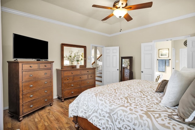 21006 Indigo Field Ln, Richmond, TX 77407 - bedroom with wood finished floors, crown molding, and a ceiling fan