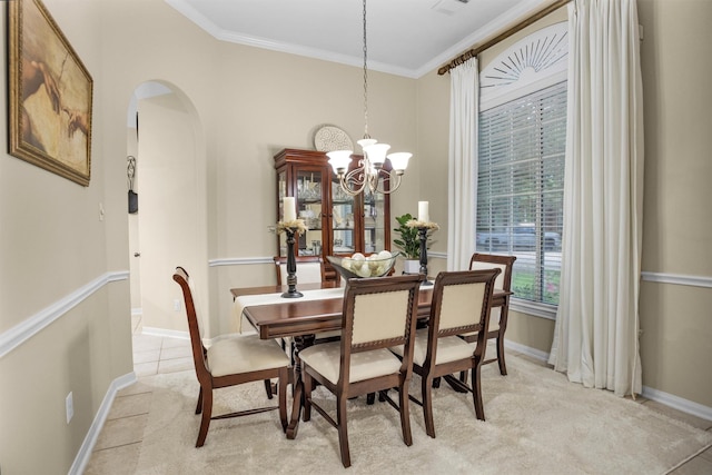 21006 Indigo Field Ln, Richmond, TX 77407 - dining room featuring arched walkways, crown molding, a chandelier, and light carpet