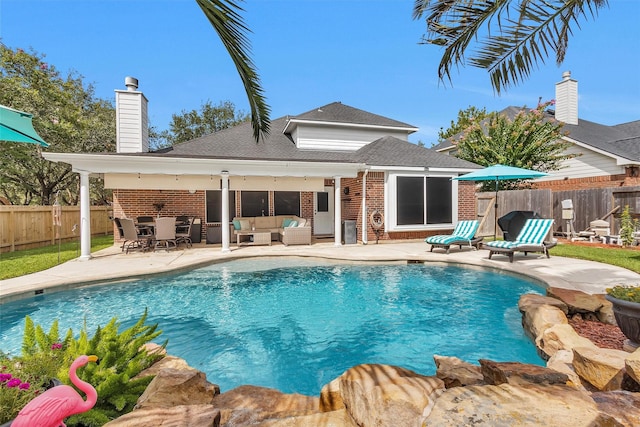 21006 Indigo Field Ln, Richmond, TX 77407 - view of pool with an outdoor living space, a fenced backyard, and a patio area