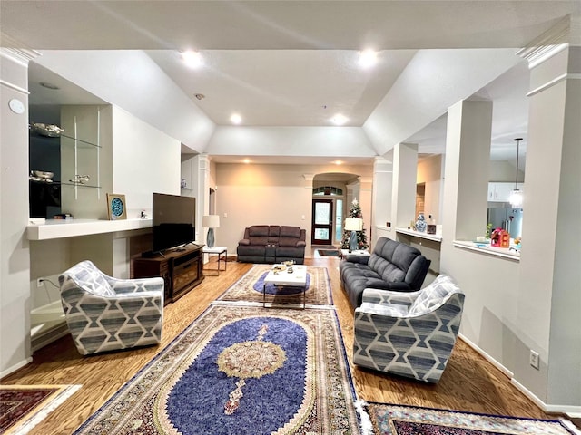 807 Epperson Way Ct, Sugar Land, TX 77479 - living area with decorative columns, wood finished floors, arched walkways, and recessed lighting