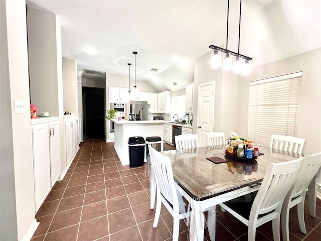 807 Epperson Way Ct, Sugar Land, TX 77479 - dining space featuring vaulted ceiling and dark tile patterned floors