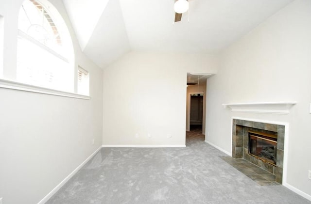 807 Epperson Way Ct, Sugar Land, TX 77479 - unfurnished living room with carpet, ceiling fan, a tile fireplace, lofted ceiling, and attic access