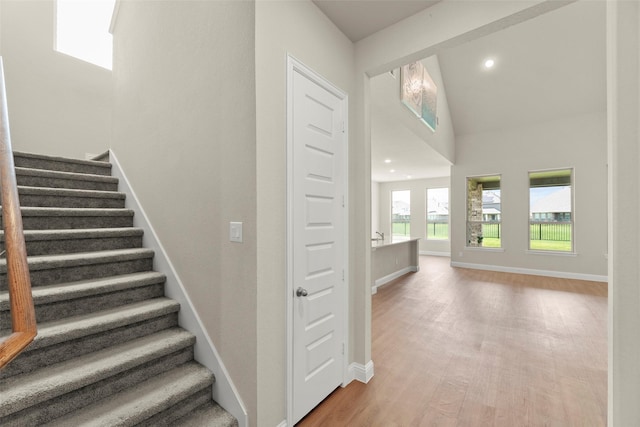 6322 Cambrai Wood Ln, Katy, TX 77493 - stairs featuring wood finished floors, recessed lighting, and high vaulted ceiling