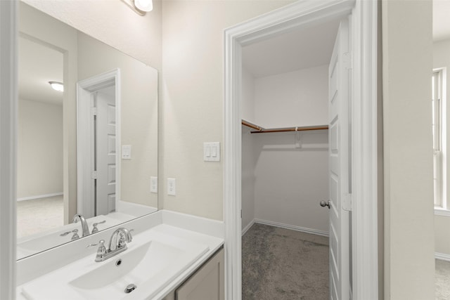 6322 Cambrai Wood Ln, Katy, TX 77493 - bathroom featuring vanity and a spacious closet