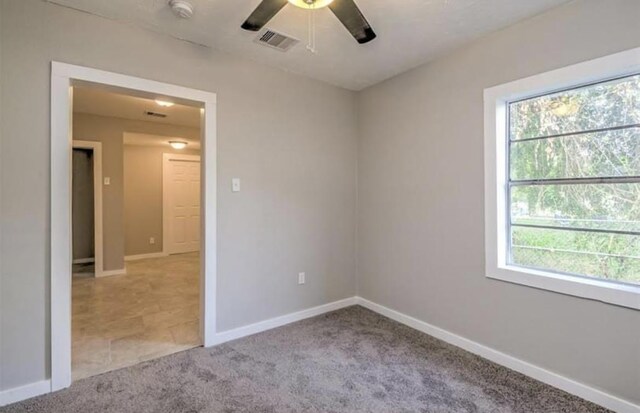 1506 Clay St, Brenham, TX 77833 - carpeted spare room with a smoke detector, healthy amount of natural light, and ceiling fan
