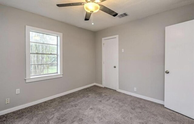 1506 Clay St, Brenham, TX 77833 - carpeted empty room featuring ceiling fan and baseboards