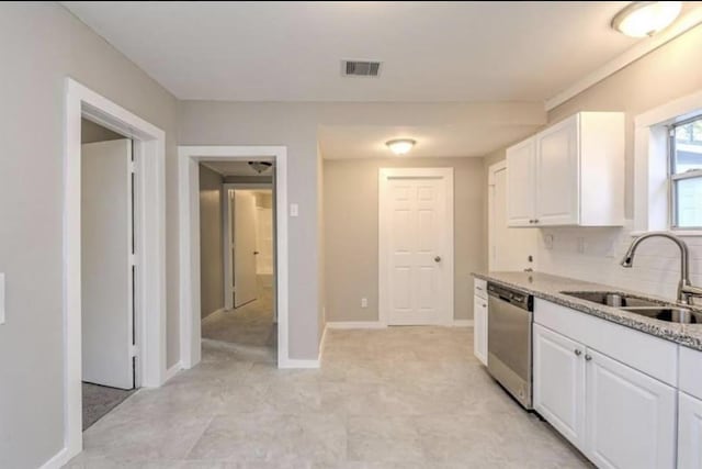 1506 Clay St, Brenham, TX 77833 - kitchen featuring dishwasher, white cabinetry, and light stone counters