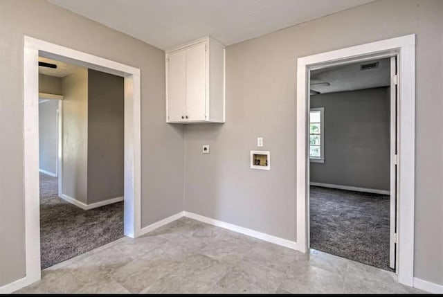 1506 Clay St, Brenham, TX 77833 - laundry room with light carpet, washer hookup, electric dryer hookup, and cabinet space