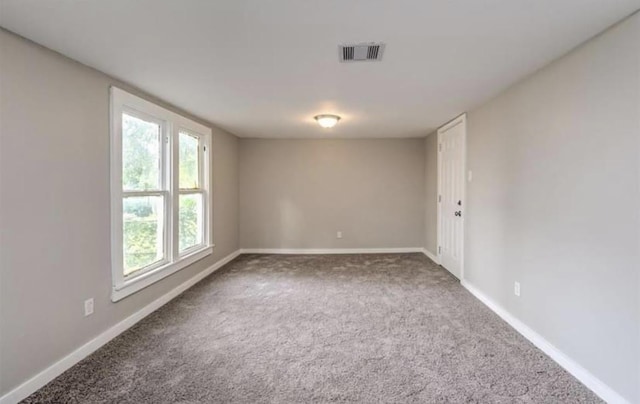 1506 Clay St, Brenham, TX 77833 - carpeted empty room with baseboards