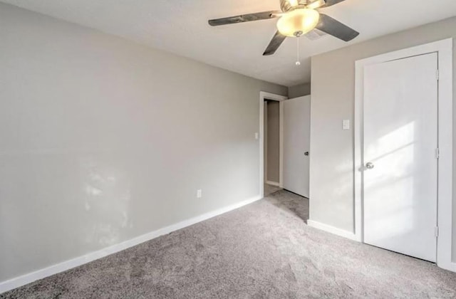 1506 Clay St, Brenham, TX 77833 - unfurnished bedroom with light carpet and a ceiling fan