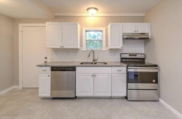 1506 Clay St, Brenham, TX 77833 - kitchen featuring stainless steel appliances, under cabinet range hood, white cabinetry, and light stone countertops