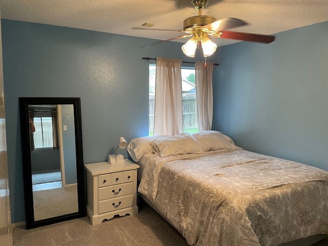 3202 The Highlands Dr, Sugar Land, TX 77478 - carpeted bedroom featuring a textured ceiling, ceiling fan, and a textured wall