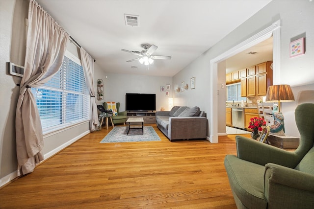 1130 W 30th St, Houston, TX 77018 - living area with light wood-type flooring and ceiling fan