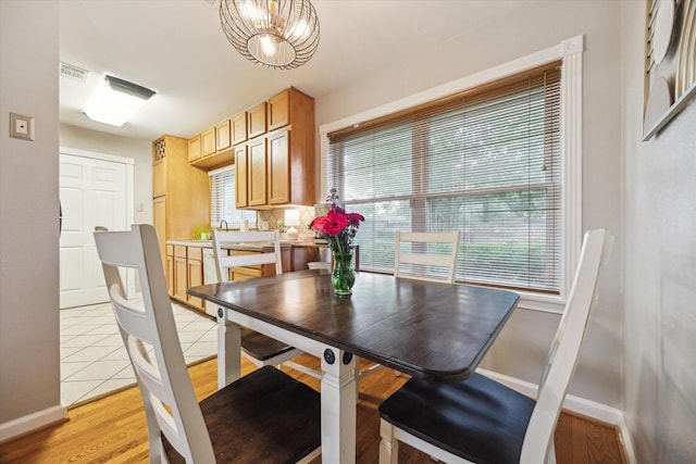 1130 W 30th St, Houston, TX 77018 - dining room with plenty of natural light, a chandelier, and light tile patterned flooring