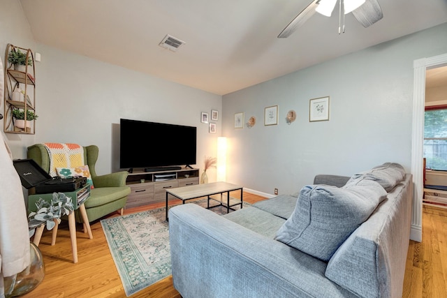 1130 W 30th St, Houston, TX 77018 - living area with light wood-style floors and a ceiling fan