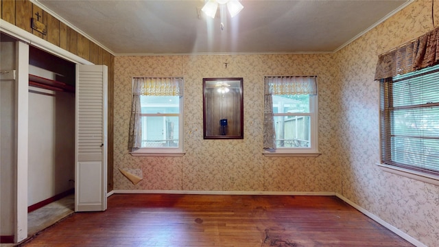 6619 Heron Dr, Houston, TX 77087 - unfurnished bedroom featuring dark wood-style floors and ornamental molding