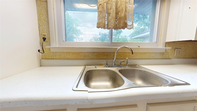6619 Heron Dr, Houston, TX 77087 - kitchen view of white cabinetry and light countertops