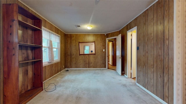 6619 Heron Dr, Houston, TX 77087 - unfurnished dining area featuring wood walls and carpet floors