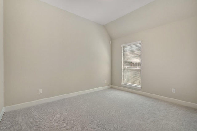 19019 Dappled Mare Cir, Tomball, TX 77377 - empty room featuring light carpet and lofted ceiling