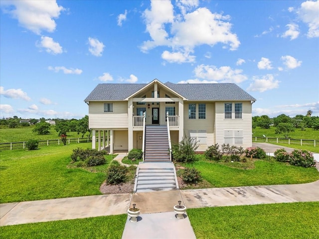 2250 Broadway St, San Leon, TX 77539 - view of front of property with stairs and covered porch