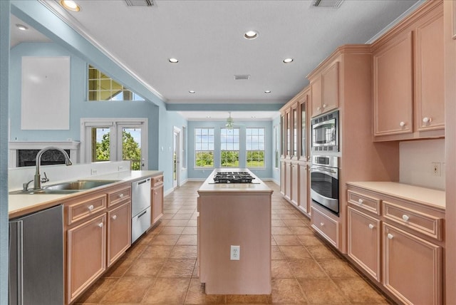 2250 Broadway St, San Leon, TX 77539 - kitchen featuring appliances with stainless steel finishes, a kitchen island, light countertops, a ceiling fan, and recessed lighting