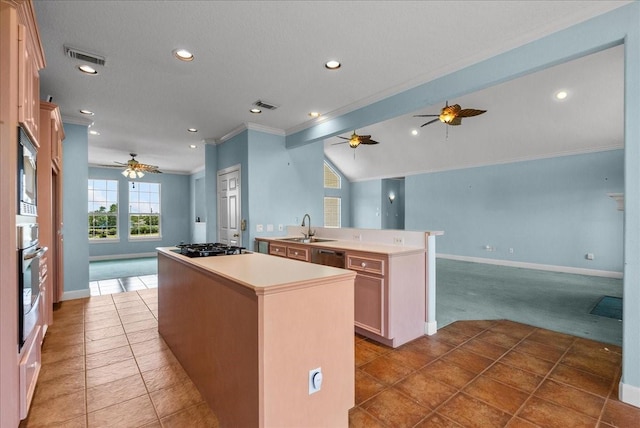 2250 Broadway St, San Leon, TX 77539 - kitchen with ceiling fan, a center island with sink, crown molding, open floor plan, and light colored carpet