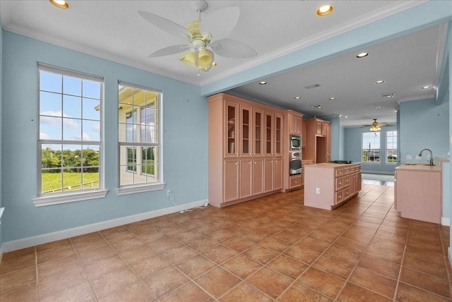 2250 Broadway St, San Leon, TX 77539 - kitchen with ceiling fan, appliances with stainless steel finishes, crown molding, recessed lighting, and light countertops