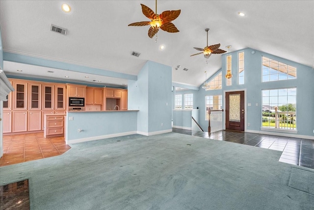 2250 Broadway St, San Leon, TX 77539 - unfurnished living room featuring ceiling fan, light carpet, light tile patterned flooring, high vaulted ceiling, and recessed lighting