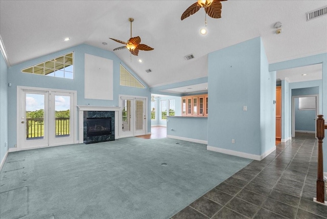 2250 Broadway St, San Leon, TX 77539 - unfurnished living room featuring a ceiling fan, a high end fireplace, high vaulted ceiling, dark carpet, and recessed lighting