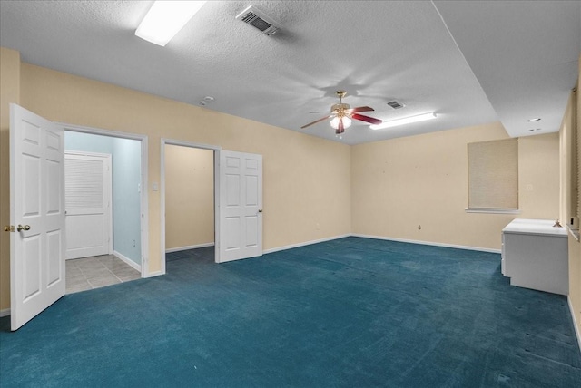 2250 Broadway St, San Leon, TX 77539 - unfurnished bedroom featuring carpet flooring, a textured ceiling, and ceiling fan
