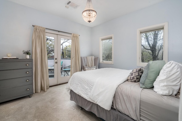 1395 Arlington St Unit 1395, Houston, TX 77008 - bedroom with access to outside, light colored carpet, a chandelier, and french doors