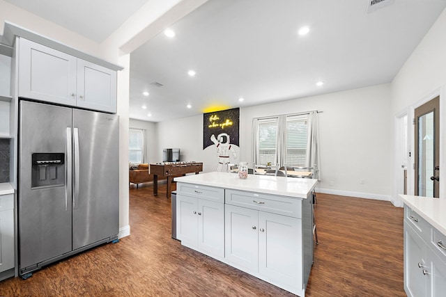 4209 Gunter St, Houston, TX 77020 - kitchen featuring stainless steel refrigerator with ice dispenser, dark wood-type flooring, plenty of natural light, and recessed lighting