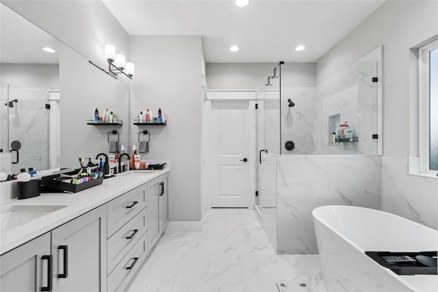 4510 Vernon St, Houston, TX 77020 - full bathroom with a marble finish shower, recessed lighting, a freestanding bath, double vanity, and marble finish floors