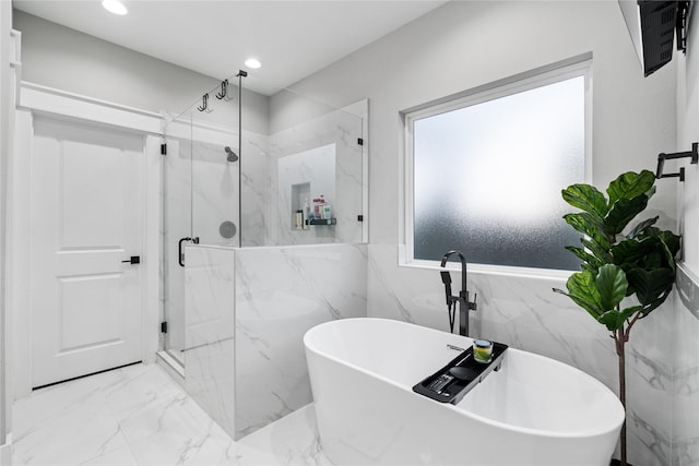 4510 Vernon St, Houston, TX 77020 - bathroom with a marble finish shower, marble tiled flooring, a freestanding bath, recessed lighting, and tile walls