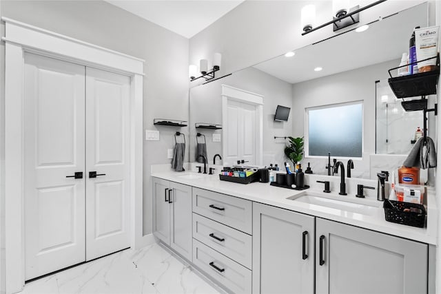 4510 Vernon St, Houston, TX 77020 - bathroom with double vanity, marble finish floors, a marble finish shower, and recessed lighting