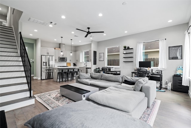 4510 Vernon St, Houston, TX 77020 - living area with ceiling fan, stairs, light wood finished floors, recessed lighting, and healthy amount of natural light