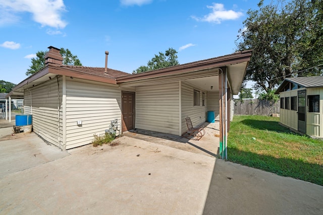 56 Wellford St, Houston, TX 77022 - rear view of property featuring a patio area and a chimney