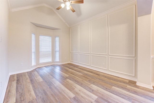 22934 Cove Timbers Ct, Tomball, TX 77375 - empty room with a ceiling fan, a decorative wall, light wood finished floors, vaulted ceiling, and ornamental molding