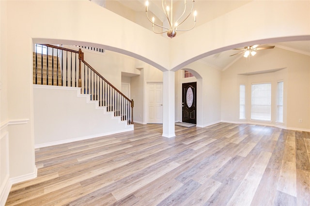 22934 Cove Timbers Ct, Tomball, TX 77375 - foyer entrance featuring light wood-type flooring, plenty of natural light, ceiling fan, and high vaulted ceiling
