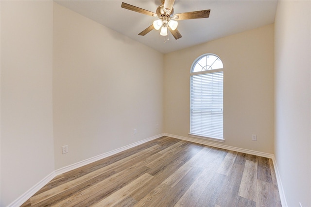 22934 Cove Timbers Ct, Tomball, TX 77375 - empty room with wood finished floors and ceiling fan