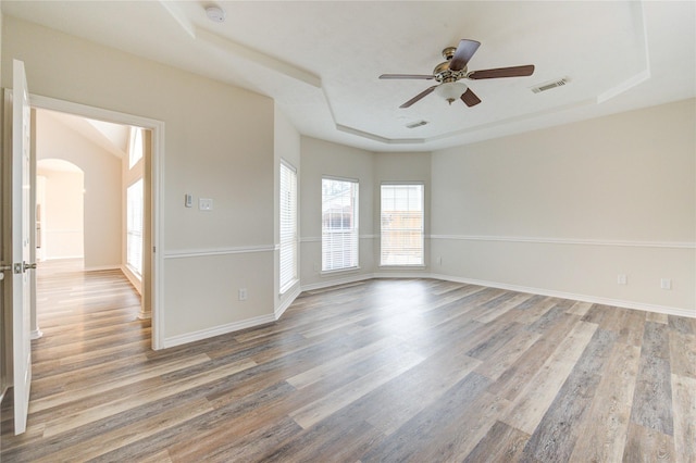 22934 Cove Timbers Ct, Tomball, TX 77375 - unfurnished room with a raised ceiling, a smoke detector, wood finished floors, and a ceiling fan