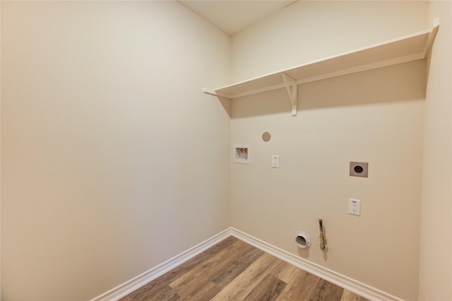 22934 Cove Timbers Ct, Tomball, TX 77375 - laundry room featuring gas dryer hookup, electric dryer hookup, washer hookup, and wood finished floors