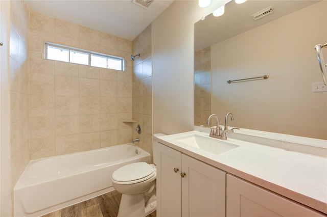 22934 Cove Timbers Ct, Tomball, TX 77375 - bathroom with wood finished floors, vanity, and bathing tub / shower combination