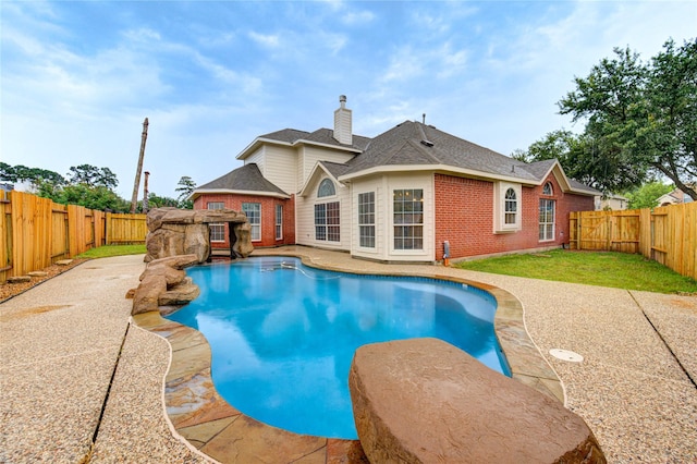 22934 Cove Timbers Ct, Tomball, TX 77375 - view of swimming pool with a fenced backyard and a patio