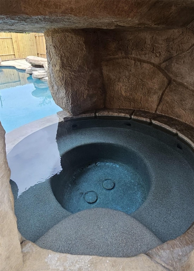 22934 Cove Timbers Ct, Tomball, TX 77375 - exterior view of a swimming pool and a hot tub