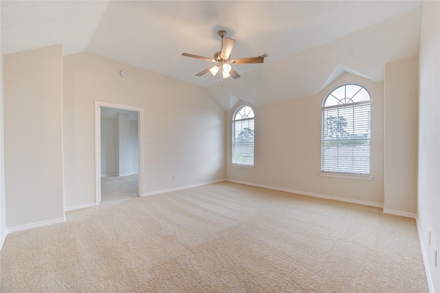 22934 Cove Timbers Ct, Tomball, TX 77375 - empty room with lofted ceiling, a ceiling fan, and light colored carpet