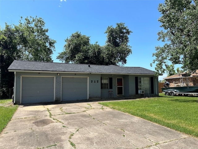 717 Circle Way, Alvin, TX 77511 - ranch-style house featuring a garage, driveway, a front lawn, and brick siding