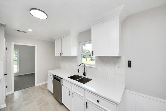 10602 Raydell Dr, Houston, TX 77031 - kitchen featuring dishwasher, light countertops, white cabinets, and tasteful backsplash